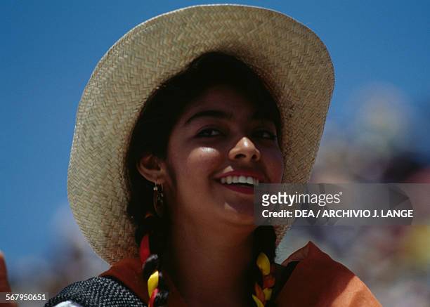 Woman in traditional costume during the celebrations at the Guelaguetza festival, Oaxaca, Mexico.