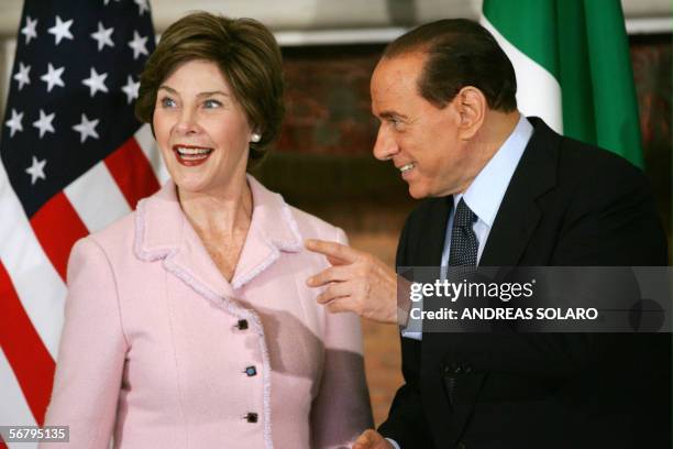 First lady Laura Bush looks away as Italy's Prime Minister Silvio Berlusconi gestures at Villa Madama in Rome 09 February 2006. Bush is on a four-day...