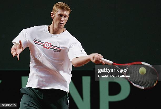 Chris Guccione of Australia plays a forehand during an Australian practice session prior to the Davis Cup first round match between Switzerland and...