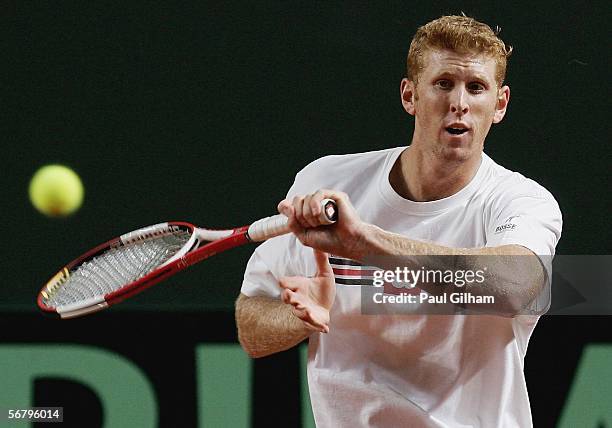 Chris Guccione of Australia plays a forehand during an Australian practice session prior to the Davis Cup first round match between Switzerland and...