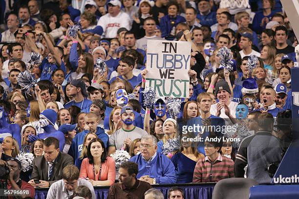 Fans of the Kentucky Wildcats hold up a sign for head coach Tubby Smith during the game against the Louisville Cardinals at Rupp Arena on December...