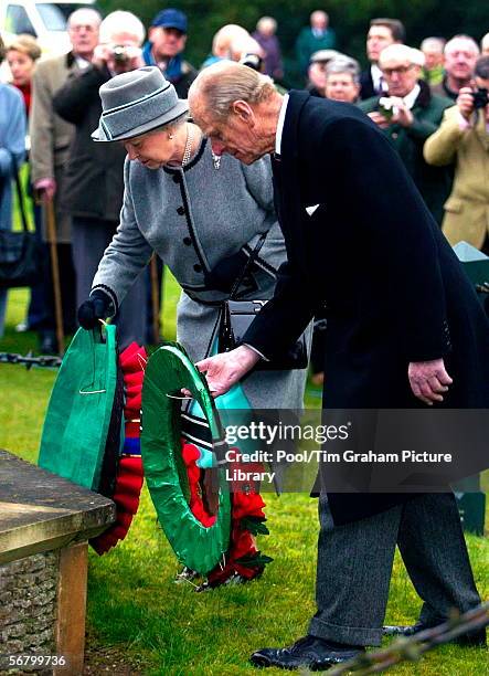 Queen Elizabeth II and Prince Philip lay a wreath at the Sandringham War Memorial in Norfolk to mark the 90th Anniversary of the World War I...