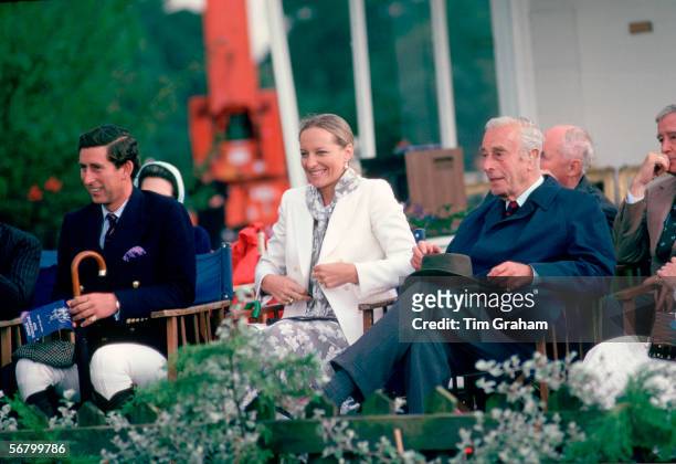 Prince Charles sitting with Princess Michael of Kent and Lord Mountbatten watching polo at Windsor.