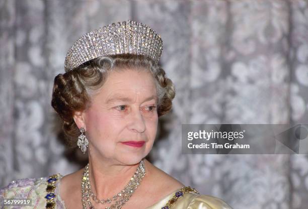 Queen Elizabeth II wears the Russian fringe diamond tiara whilst attending a State Banquet in Reykjavik, Iceland.