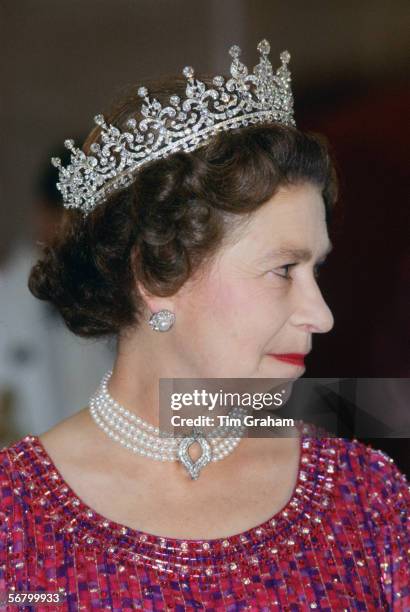 Queen Elizabeth II wears a four strand diamond and pearl choker with 'Granny's Tiara' to an engagement in Bangladesh.