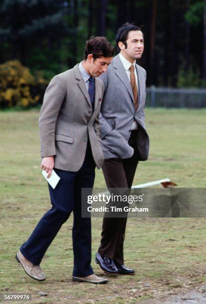 Prince Charles walks with King Constantine of Greece in Windsor Great Park. .