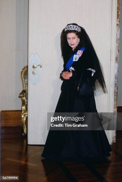 Queen Elizabeth II at the Vatican for an audience with the Pope. The Queen is wearing the traditional black full length dress that protocol demands...