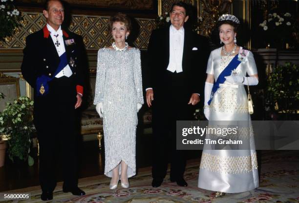 Queen Elizabeth II and Prince Philip with American President Ronald Reagan and his wife, Nance Reagan at Windsor Castle for a State Banquet.