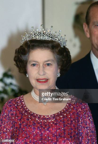 Queen Elizabeth II wears a four strand diamond and pearl choker with 'Granny's Tiara' to an engagement in Bangladesh.