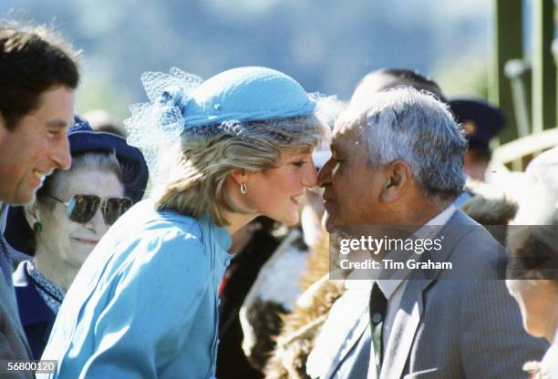 Diana Princess of Wales greets a Maori man with a traditional Hongi, rubbing of noses, during a walkabout in Wellington, New Zealand.