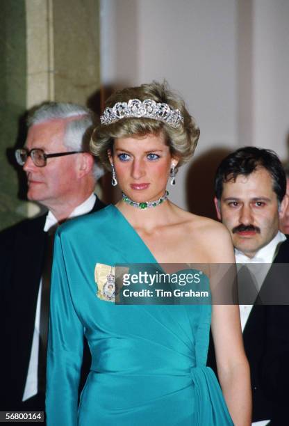 Princess Diana attends a banquet at Claridges Hotel in London wearing the Spencer Tiara and Queen Mary's emerald and diamond choker.