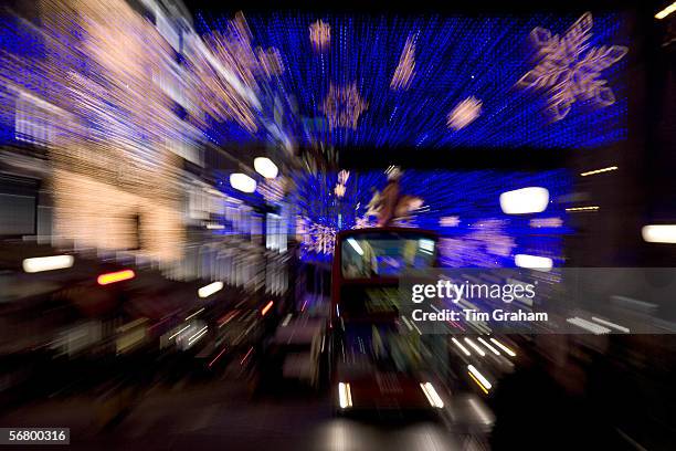 Blurred image of Christmas decorations and traffic in Regent Street, London, United Kingdom.