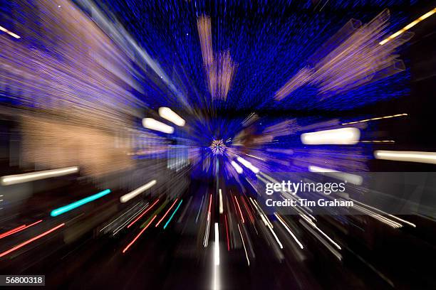 Blurred image of Christmas decorations and traffic in Regent Street, London, United Kingdom.