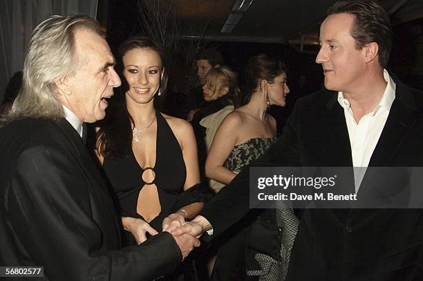 Peter Stringfellow, Bella Wright and David Cameron attend the Conservative Party Black & White Ball at Old Billingsgate Market on February 8, 2006 in...