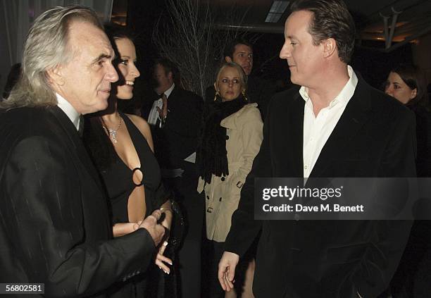 Peter Stringfellow, Bella Wright and David Cameron attend the Conservative Party Black & White Ball at Old Billingsgate Market on February 8, 2006 in...
