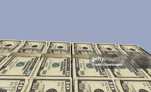 close-up of bundles of american ten dollar bills - banknote stock illustrations