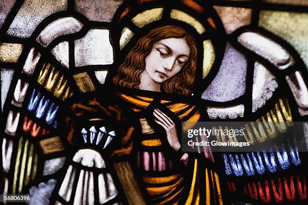 low angle view of stained glass window - stained glass angel stock pictures, royalty-free photos & images