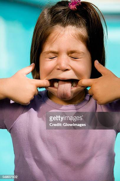 close-up of a girl making a face - human mouth stock pictures, royalty-free photos & images