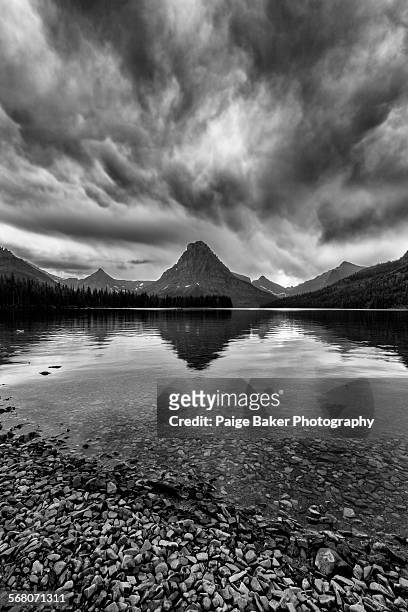 storm over two medicine lake - two medicine lake montana stockfoto's en -beelden