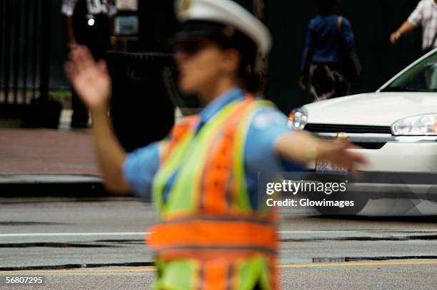 close-up of a crossing guard directing traffic, chicago, illinois, usa - 交通誘導員 ストックフォトと画像