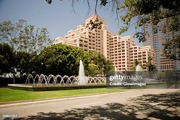 fountain on a lawn outside a building, sacramento, california, usa - sacramento stock pictures, royalty-free photos & images