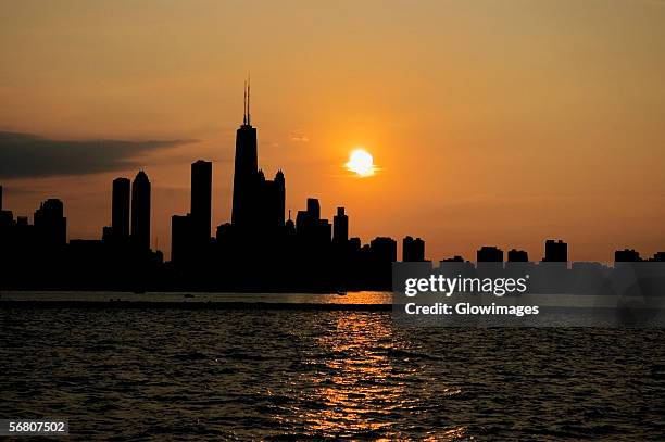 buildings on a waterfront at sunset, chicago, illinois, usa - generic location stock pictures, royalty-free photos & images