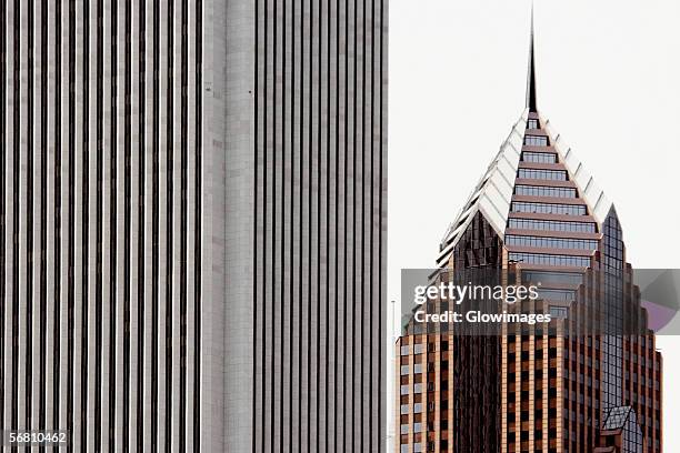 close-up of two buildings in a city, aon center, prudential plaza tower, chicago, illinois, usa - aon center chicago stock pictures, royalty-free photos & images