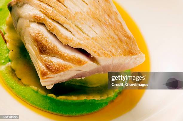 close-up of a dish of filleted fish - filleted stock pictures, royalty-free photos & images