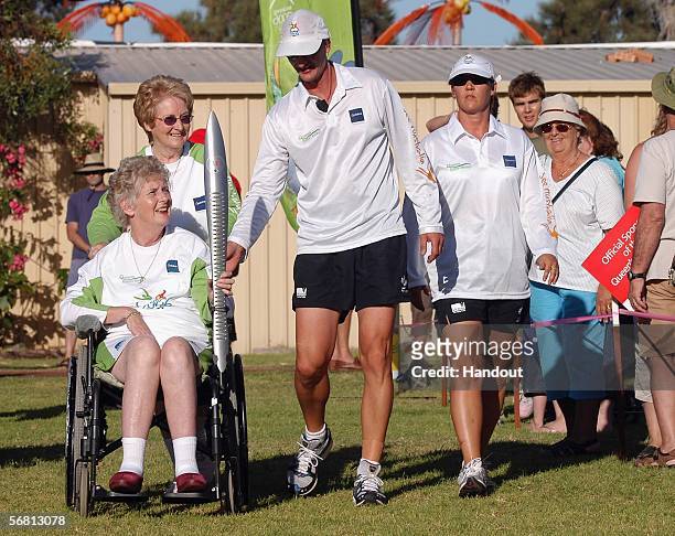 Four-time Olympic gold medallist Betty Cuthbert arrives at Mandura Hall Park with the Melbourne 2006 Queen's Baton during the Melbourne 2006 Queen's...