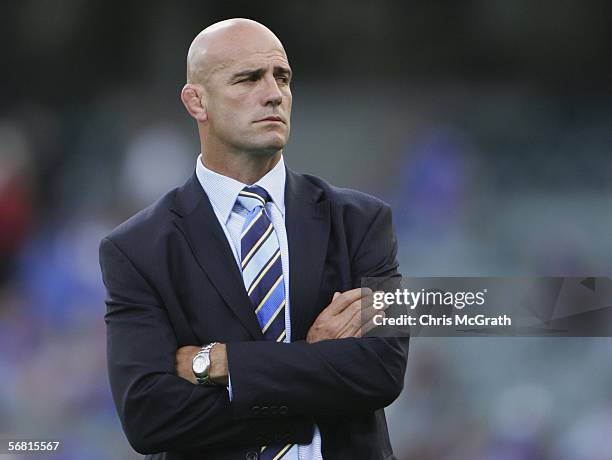 Force coach John Mitchell watches his players warm up prior to the start of the round one Super 14 match between the Western Force and the Brumbies...