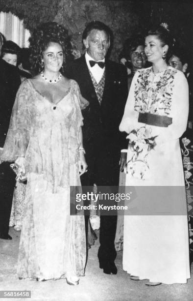 Liz Taylor and her husband Richard Burton meet Princess Grace of Monaco at a Red Cross Gala in Monaco, 7th August 1971.