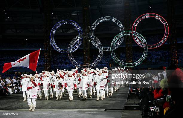 Hockey player Danielle Goyette carries the Canadian flag in front of her teammates during the Opening Ceremony of the Turin 2006 Winter Olympic Games...