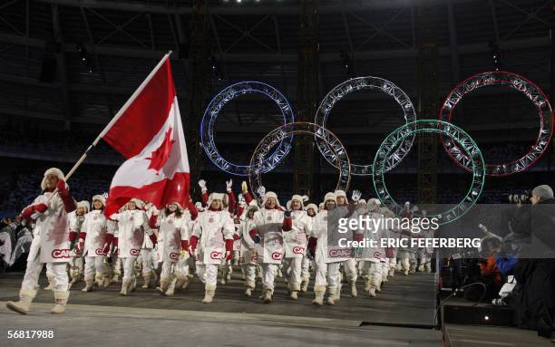 Ice hockey athlete Danielle Goyette is the flag bearer for the Canadian delegation during the opening ceremonies of the 2006 Winter Olympics 10...