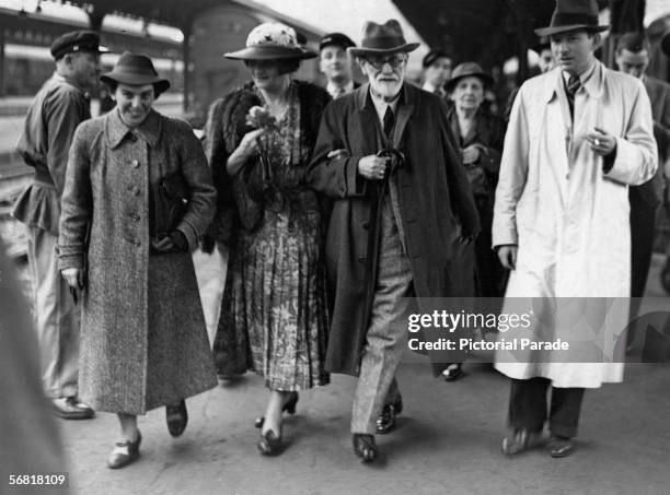Austrian psychologist Sigmund Freud arrives in Paris after leaving Vienna en route to London, Paris, France, June 1938. He is accompanied by his...