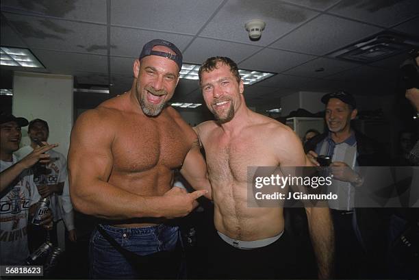 American professional wrestler Bill Goldberg clowns around with Scott Stevens of the New Jersey Devils in the locker room during the Stanley Cup...