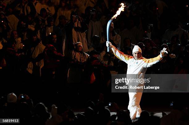 Italian downhill skier Alberto Tomba carries the Olympic flame during the Opening Ceremony of the Turin 2006 Winter Olympic Games on February 10,...