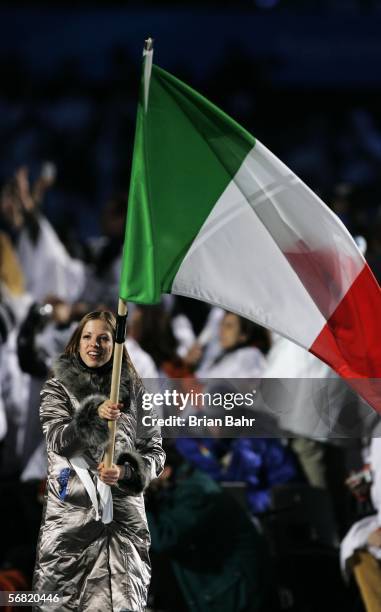 Skater Carolina Kostner carries the Italian flag during the Opening Ceremony of the Turin 2006 Winter Olympic Games on February 10, 2006 at the...