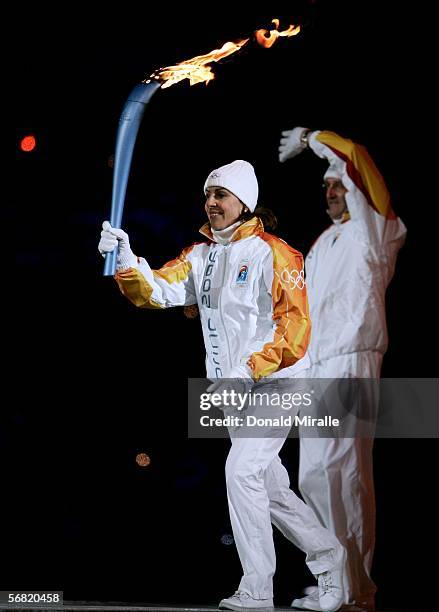 Deborah Compagnoni runs with the Olympic flame during the Opening Ceremony of the Turin 2006 Winter Olympic Games on February 10, 2006 at the Olympic...