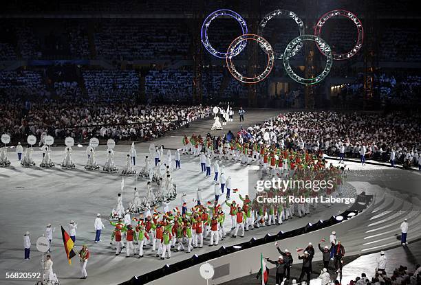 German biathlete athlete Kati Wilhelm carries the German flag as she attends the Olympic Stadium during the Opening Ceremony of the Turin 2006 Winter...