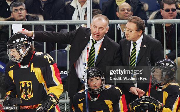 Head coach Peter Kathan of Germany shouts out instructions to his team as they take on Finland in the women's ice hockey Preliminary Round Group B...