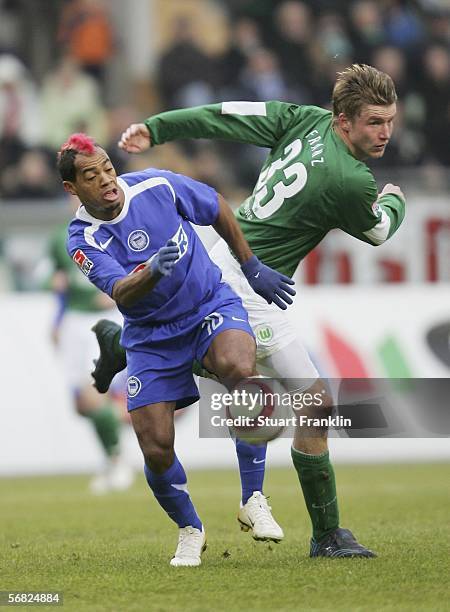 Maik Franz of Wolfsburg challenges Marcelinho of Berlin during the Bundesliga match between VFL Wolfsburg and Hertha BSC Berlin at the Volkswagen...