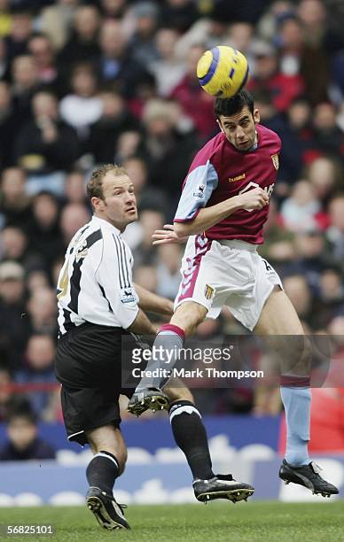 Mark Delaney of Aston Villa tangles with Alan Shearer of Newcastle during the Barclays Premiership match between Aston Villa and Newcastle at Villa...