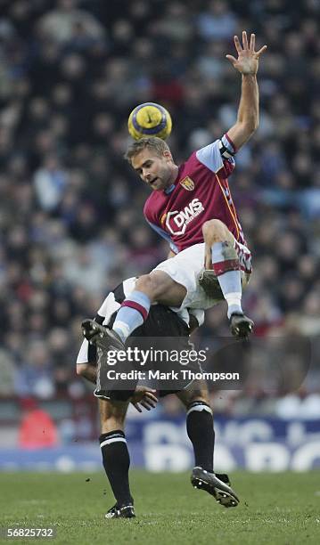 Olof Mellberg of Aston Villa tangles with Alan Shearer of Newcastle during the Barclays Premiership match between Aston Villa and Newcastle at Villa...