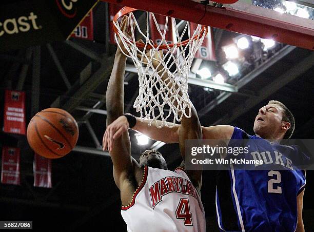 Josh McRoberts of the Duke Blue Devils fouls Travis Garrison of the Maryland Terrapins in second half action February 11, 2006 at Comcast Center in...