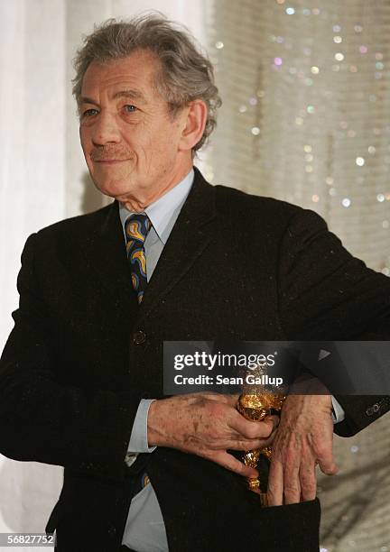 Actor Sir Ian McKellen makes as if to put his Honourary Golden Bear for Lifetime Achievement Award in his pocket shortly after receiving it at the...