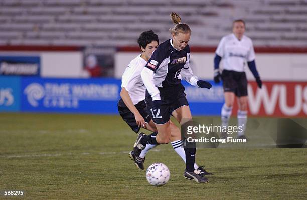 Krista Davey of the New York Power dribbles the ball against the Boston Breakers during the WUSA game in Richmond, Virginia on March 23, 2002. The...