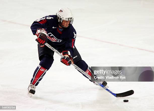 Helen Resor of the United States skates with the puck during the women's ice hockey Preliminary Round Group B match against Switzerland on Day 1 of...