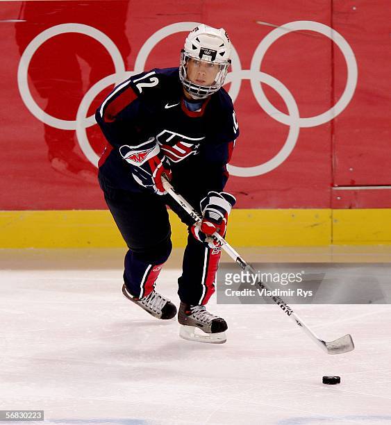 Jenny Potter of the United States juggles the puck during the women's ice hockey Preliminary Round Group B match against Switzerland on Day 1 of the...