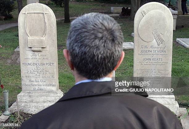 Man stands in front of the graves of English poets Percy Bysshe Shelley and John Keats at a non-Catholic cemetery in Rome, 09 February 2006. The...