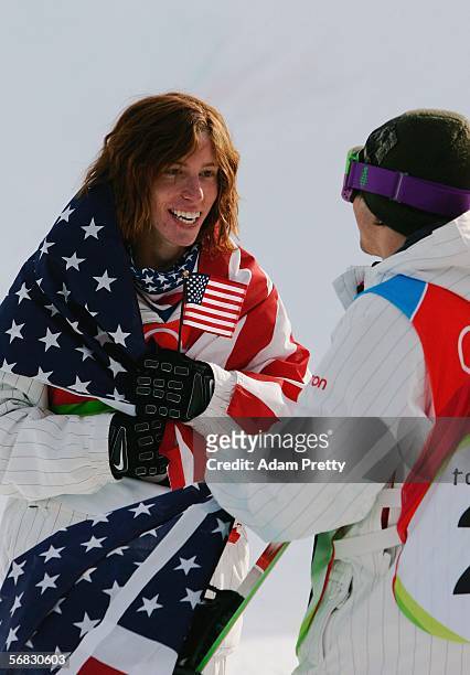 Shaun White of the United States celebrates after winning the gold medal in the Mens Snowboard Half Pipe Final on Day 2 of the 2006 Turin Winter...